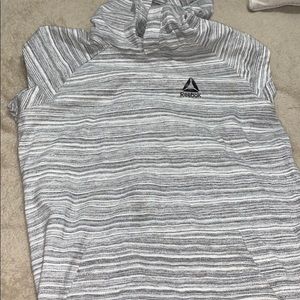 Grey and white Reebok shirt with hood